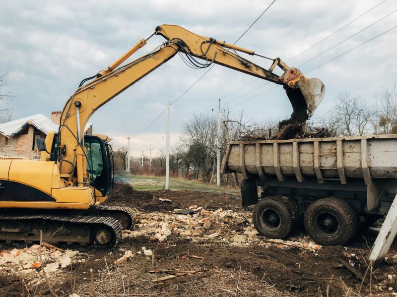 Prepares land for building